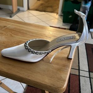 Touch ups shoes size 9.5W color white. Cleaning out my closet and wore one time.